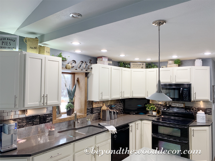 Beyond the Wood Decorating above kitchen cabinets